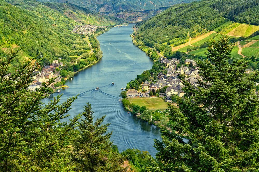 River flowing through green countryside