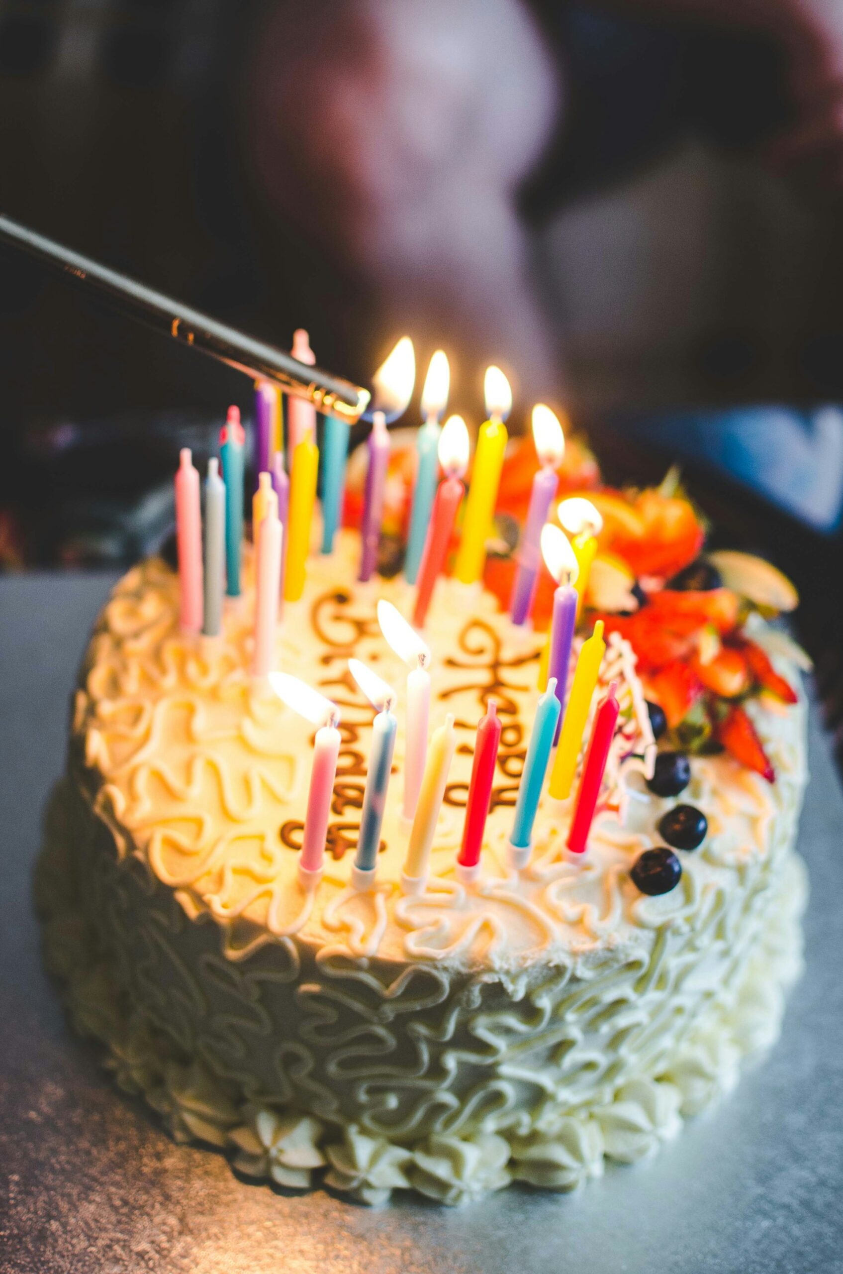 Birthday cake candles being lit
