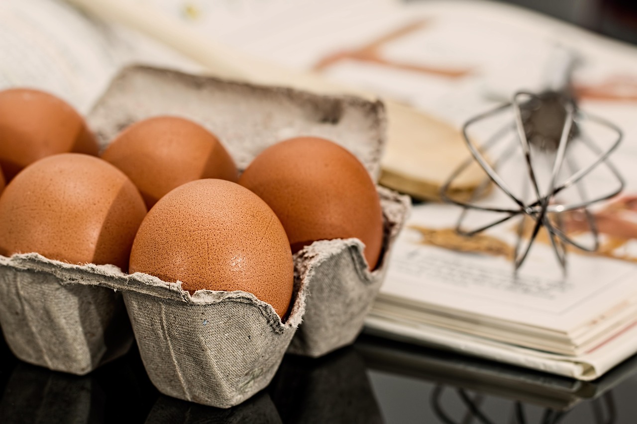 Eggs and a whisk used for baking